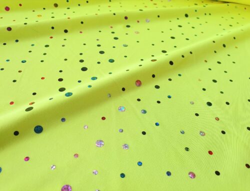 Tessuto jersey con pois di paillettes in colori fluo